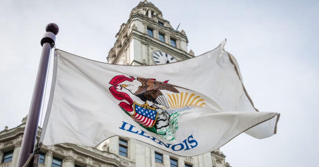 a flag flying in front of a building