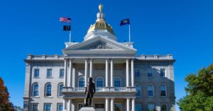 The New Hampshire State House of Representatives, a prominent building representing the state's legislative authority and history.